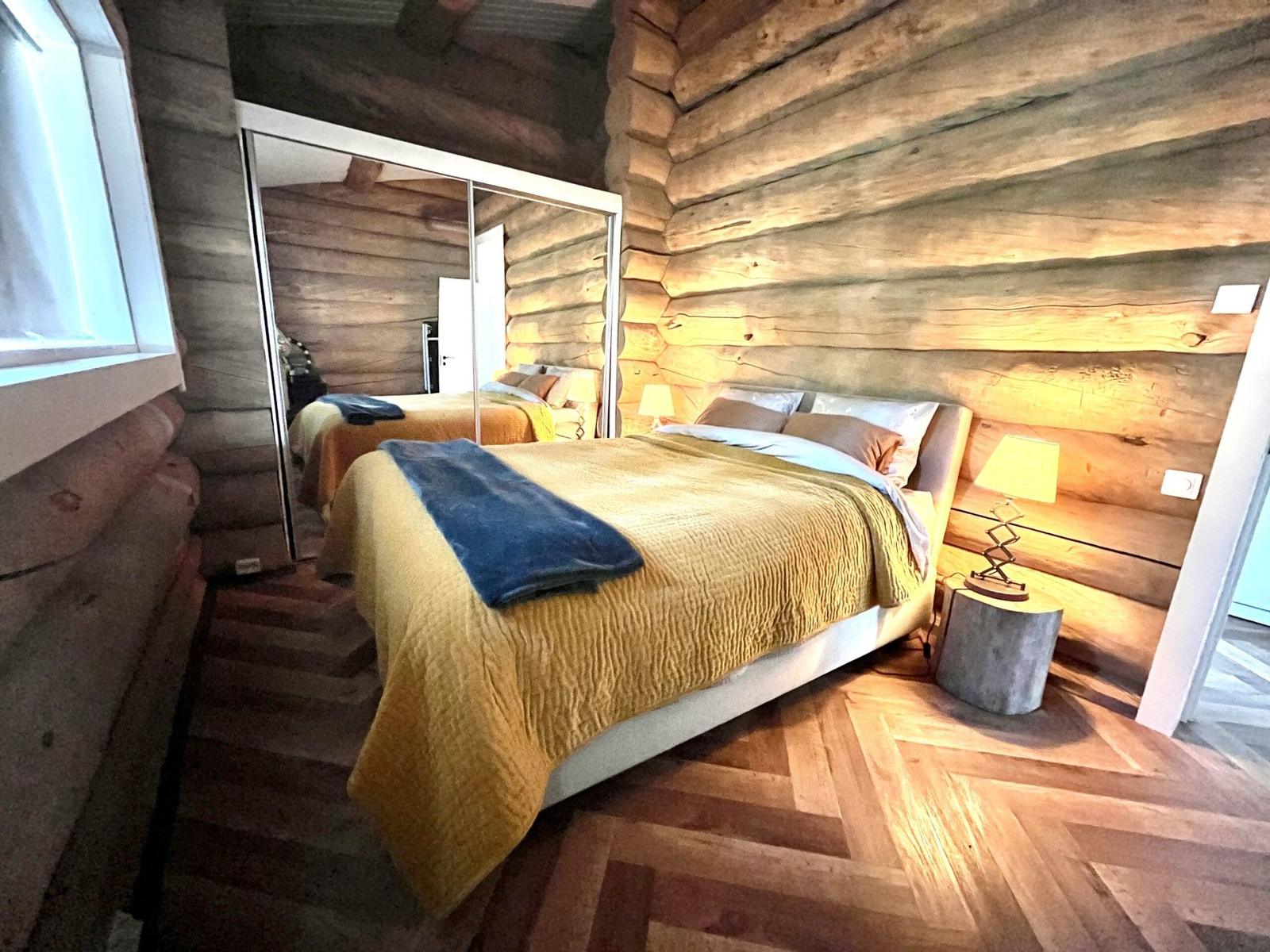 Master bedroom with log walls