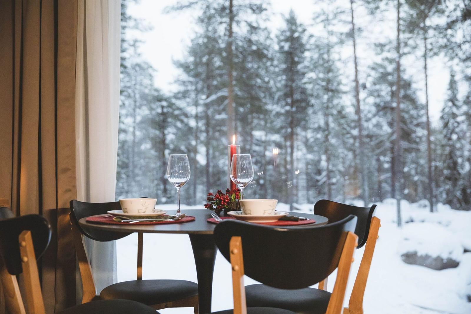 Dining table set against the winter forest