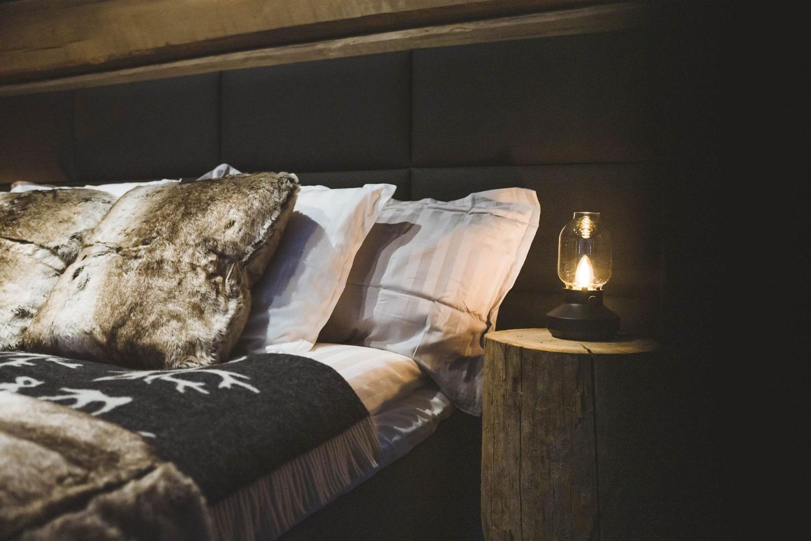 Bed detail with a lantern