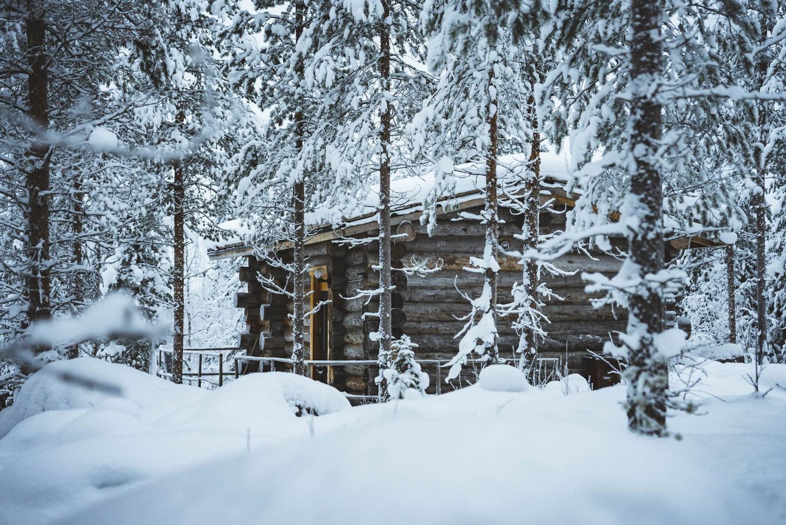 Log cabin in deep snow