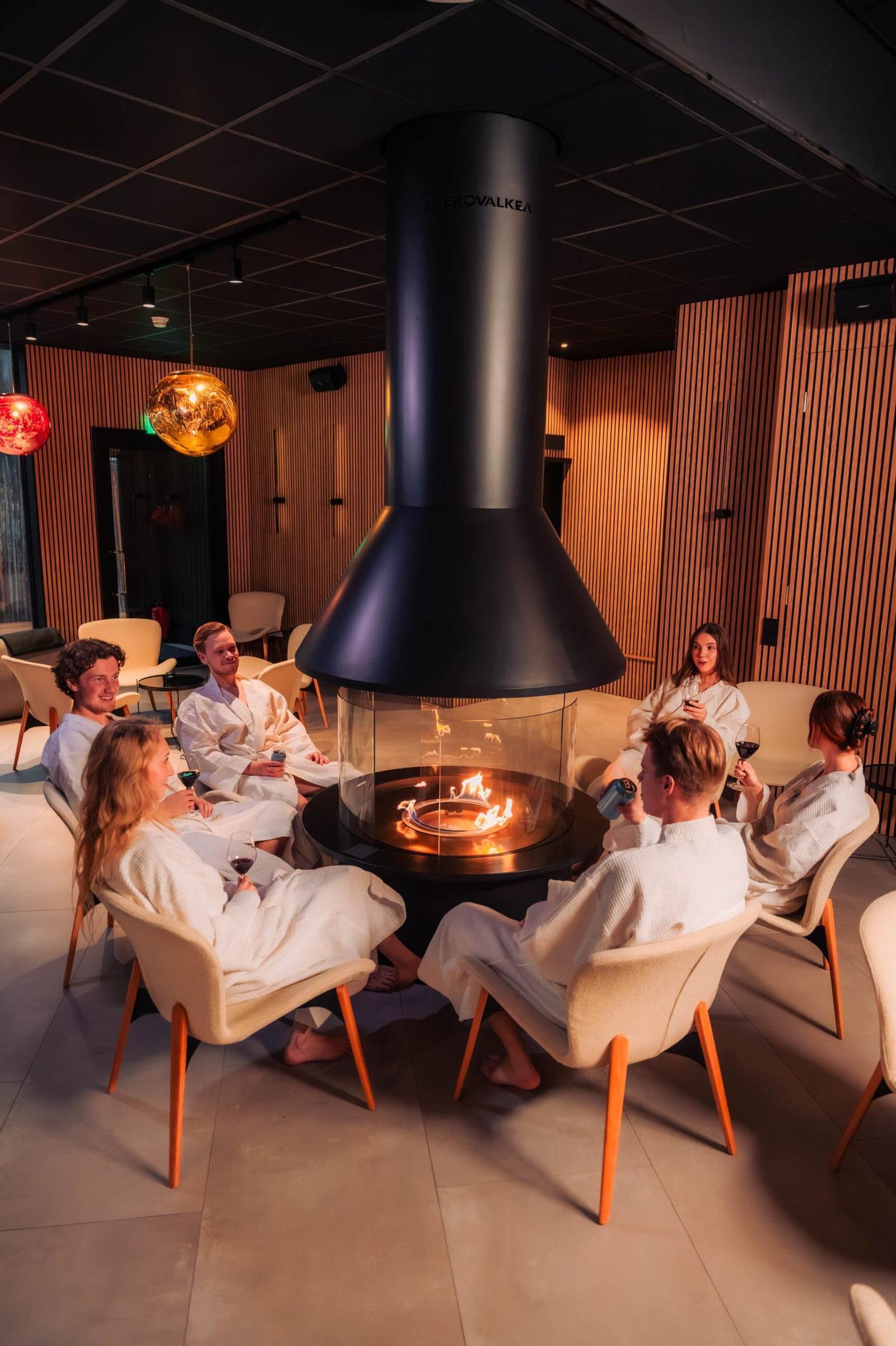 Guests on the lit sauna benches