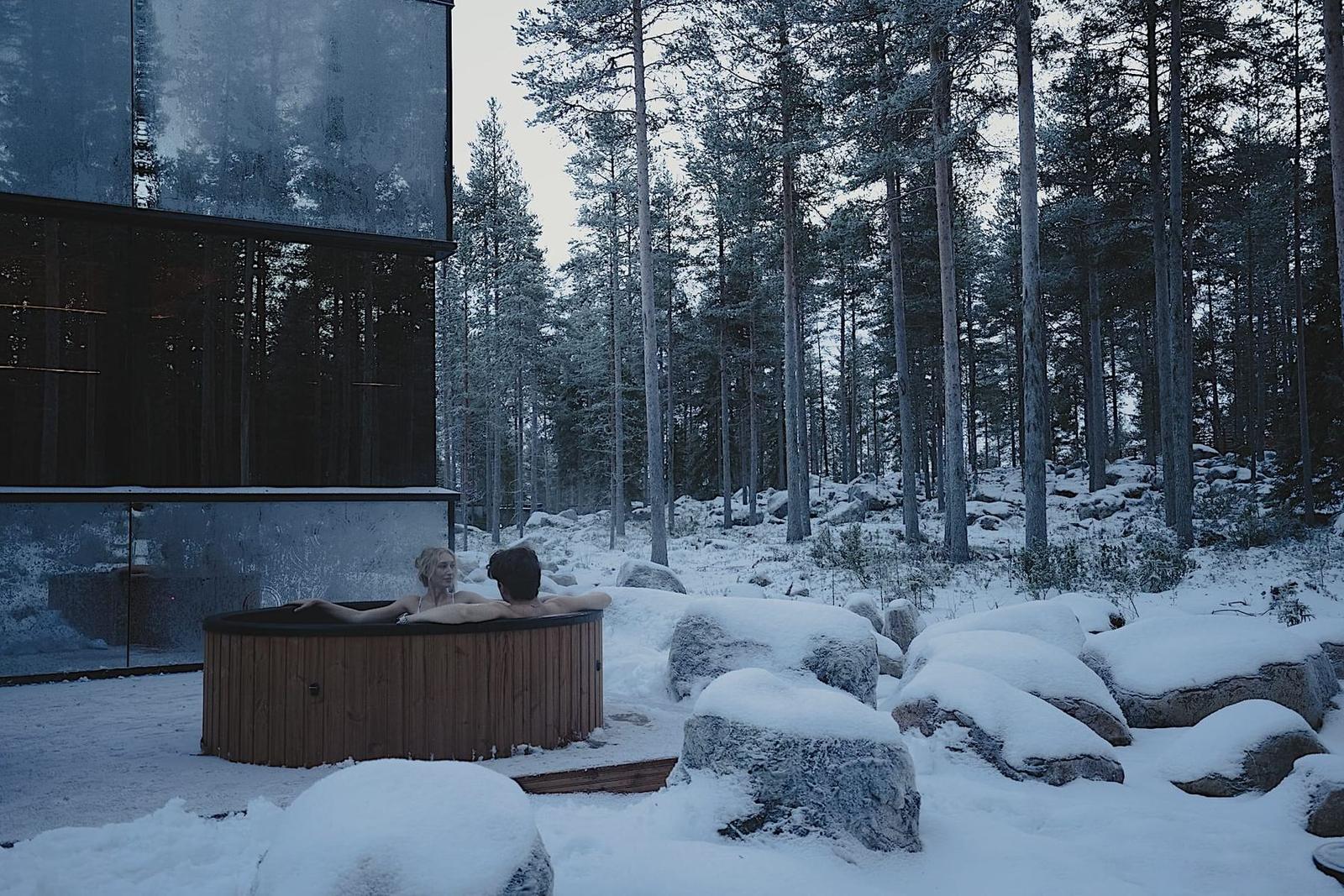 Outdoor warm water in the snow at the Arctic Forest Spa