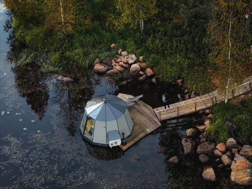 Aurora Hut floating on the river in autumn